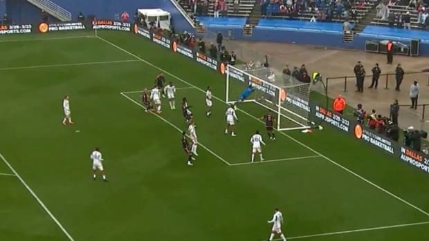 FC Dallas keeper Maarten Paes pictured making a save to stop an Olimpico goal being scored by Inter Miami captain Lionel Messi (not in shot) during a pre-season exhibition game in January 2024